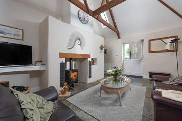 The sitting-room is beautifully furnished with comfort in mind.