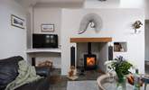 The gorgeous wood-burner sits in a fabulous feature fireplace. - Thumbnail Image