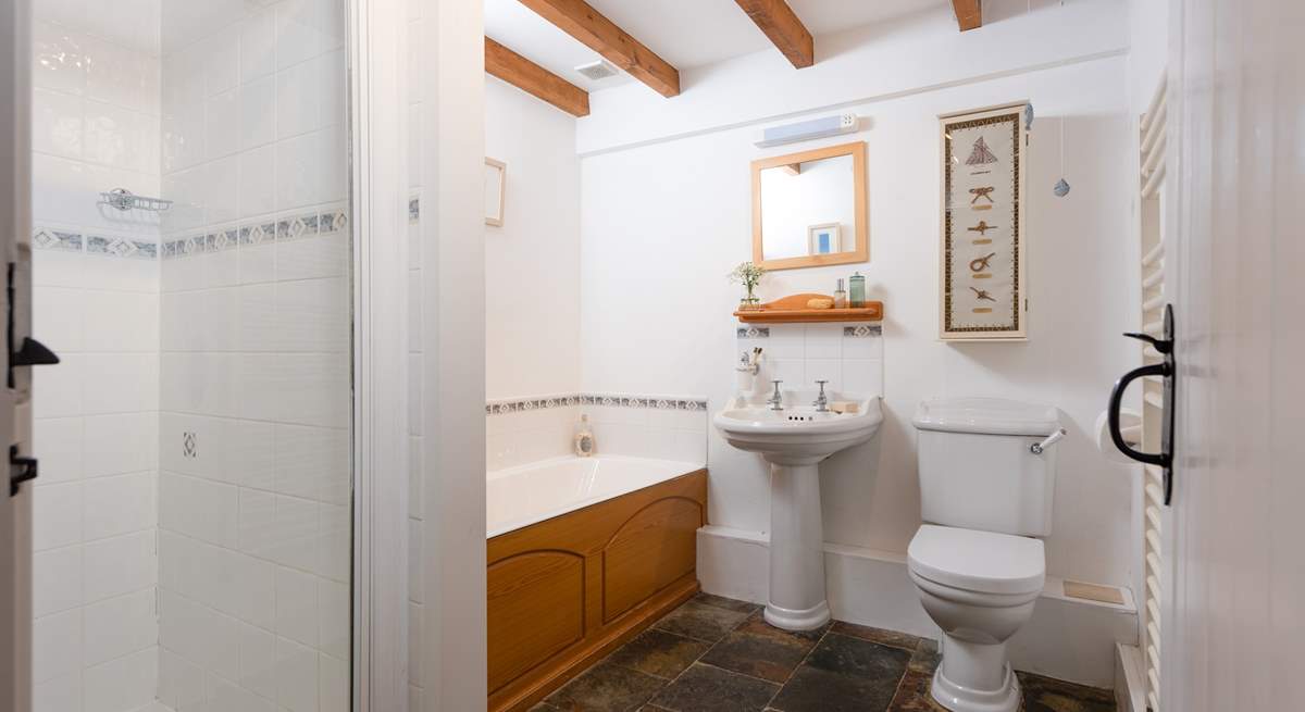 The family bathroom on the ground floor has a bath and separate shower cubicle.