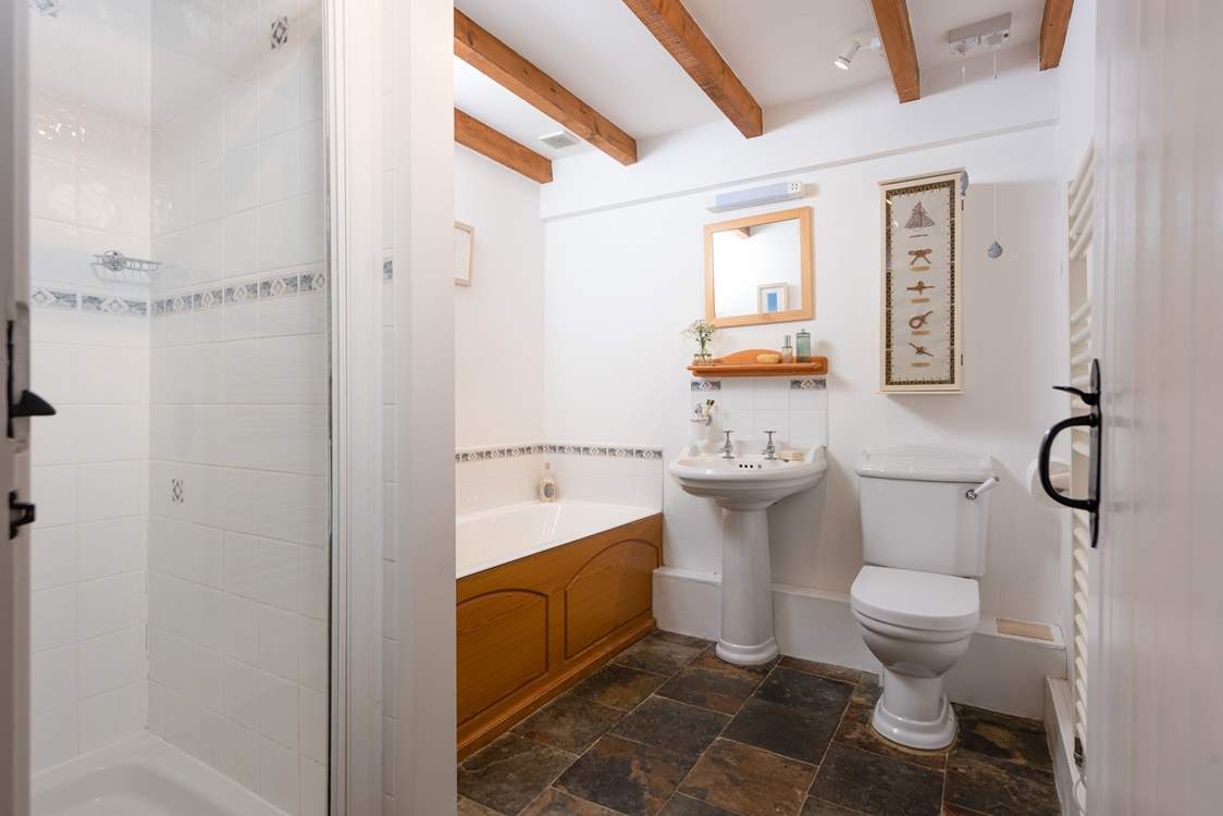 The family bathroom on the ground floor has a bath and separate shower cubicle.
