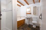 The family bathroom on the ground floor has a bath and separate shower cubicle.
