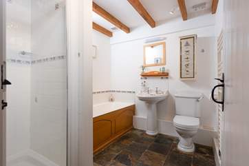 The family bathroom on the ground floor has a bath and separate shower cubicle.
