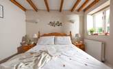 The double bedroom on the ground floor has a king-size bed for a great night's sleep. - Thumbnail Image