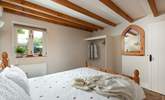 The double bedroom has characterful beams. - Thumbnail Image