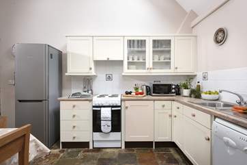 The kitchen is well-equipped and comes with the all-important dishwasher.