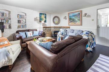 This warm and welcoming sitting-room provides the perfect place to relax on holiday.