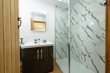 The modern shower-room is very smart and stylish.