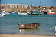 Traditional fishing boats still work the waters off St Ives.
