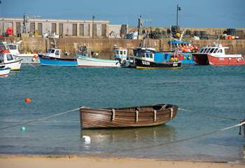 Traditional fishing boats still ply the waters of St Ives.