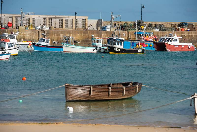 Traditional fishing boats still ply the waters of St Ives.