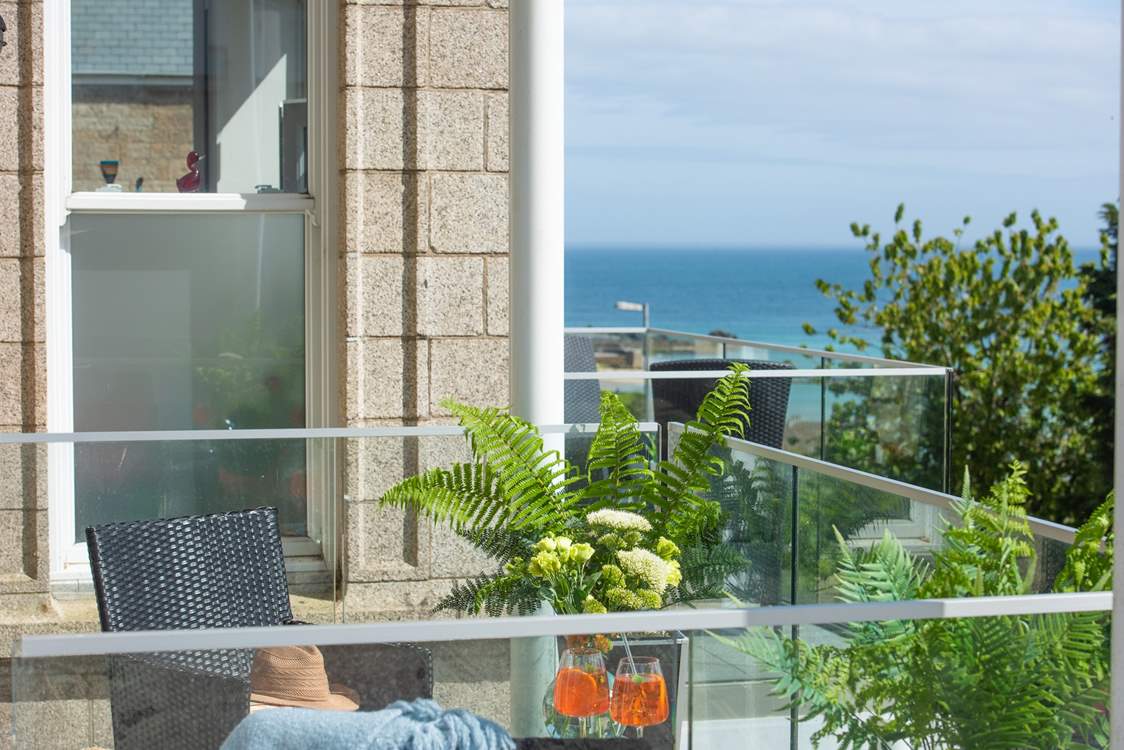 The balcony looks down towards the white sandy beach of Porthminster.