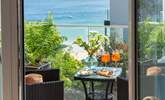 The balcony off Bedroom 1 looks out over the turquoise waters of St Ives bay towards Godrevy lighthouse.  - Thumbnail Image