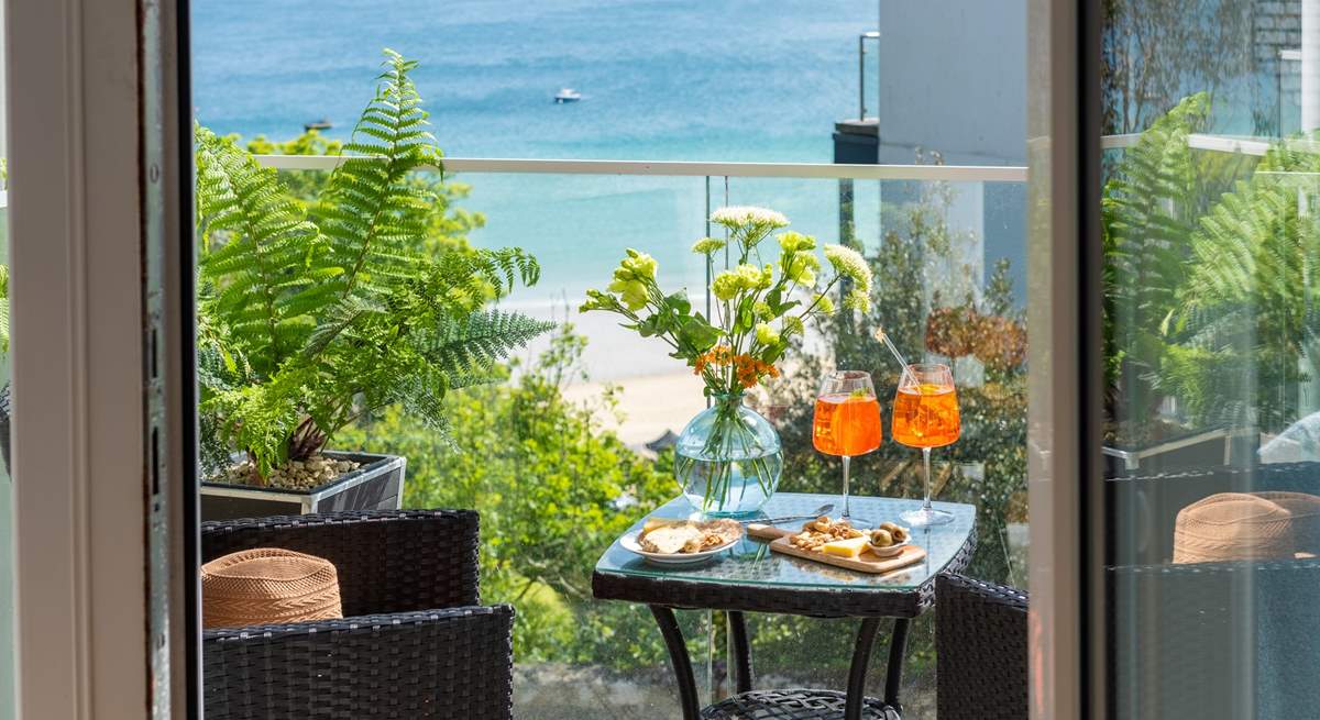 The balcony off Bedroom 1 looks out over the turquoise waters of St Ives bay towards Godrevy lighthouse. 