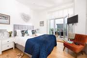 Bedroom 1 has a king-size bed, sumptuous linens and sea views from the balcony.