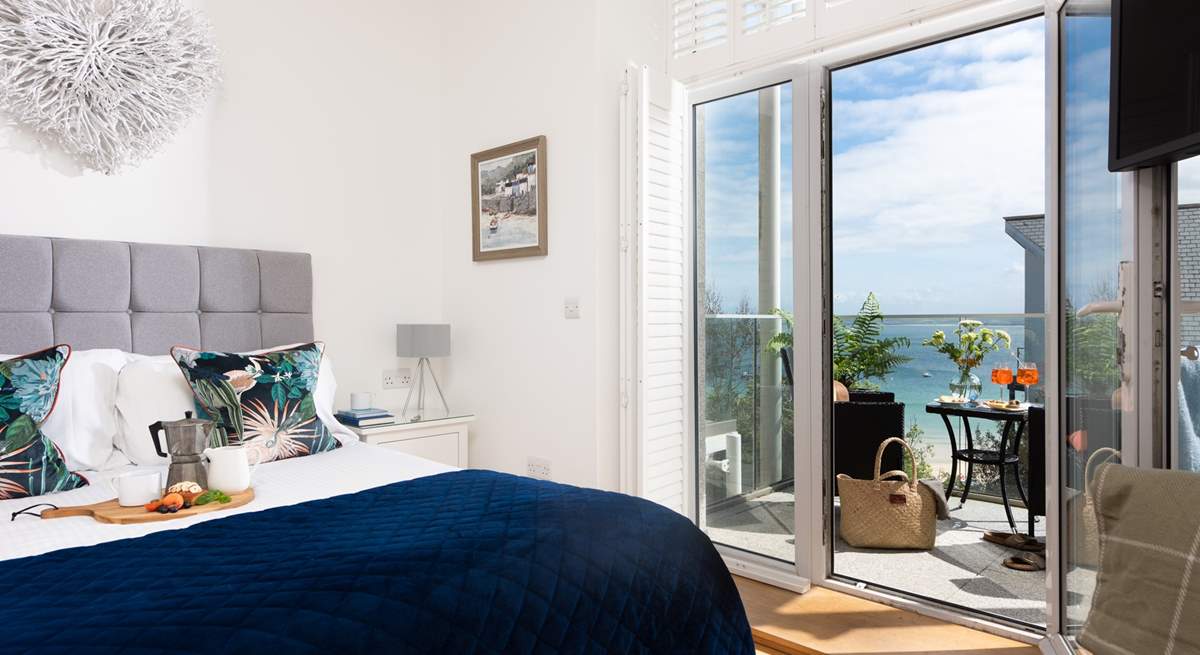 Bedroom 1 has a stunning balcony where you can watch the sailing boats cruise past.