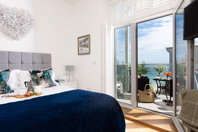 Bedroom 1 has a stunning balcony where you can watch the sailing boats cruise past.