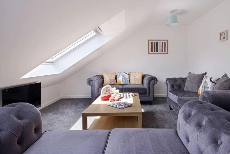 The open plan living space has plenty of space for everyone to relax. 