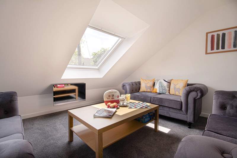 The cosy sitting-area is tucked into the eaves, enjoy a classic game of Scrabble perhaps. 