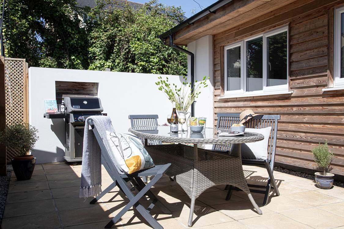 The sunny sheltered patio is perfect for a lunch time barbecue. 