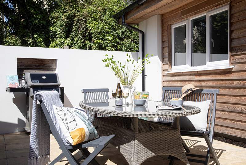The sunny sheltered patio is perfect for a lunch time barbecue. 