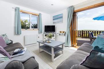 The gorgeous open plan living space has bi-fold doors leading to a fabulous balcony.