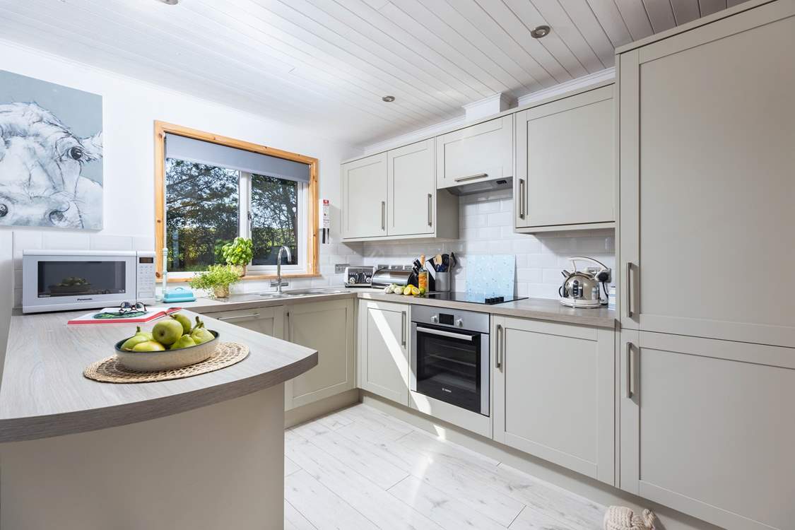 The sleek kitchen has all you need.