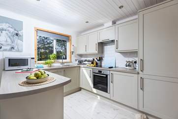 The sleek kitchen has all you need.