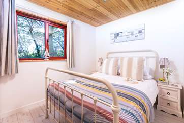 The pretty double bedroom on the ground floor.