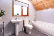 The bathroom on the first floor is the ideal place for a long soak after a busy day.