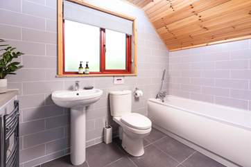 The bathroom on the first floor is the ideal place for a long soak after a busy day.