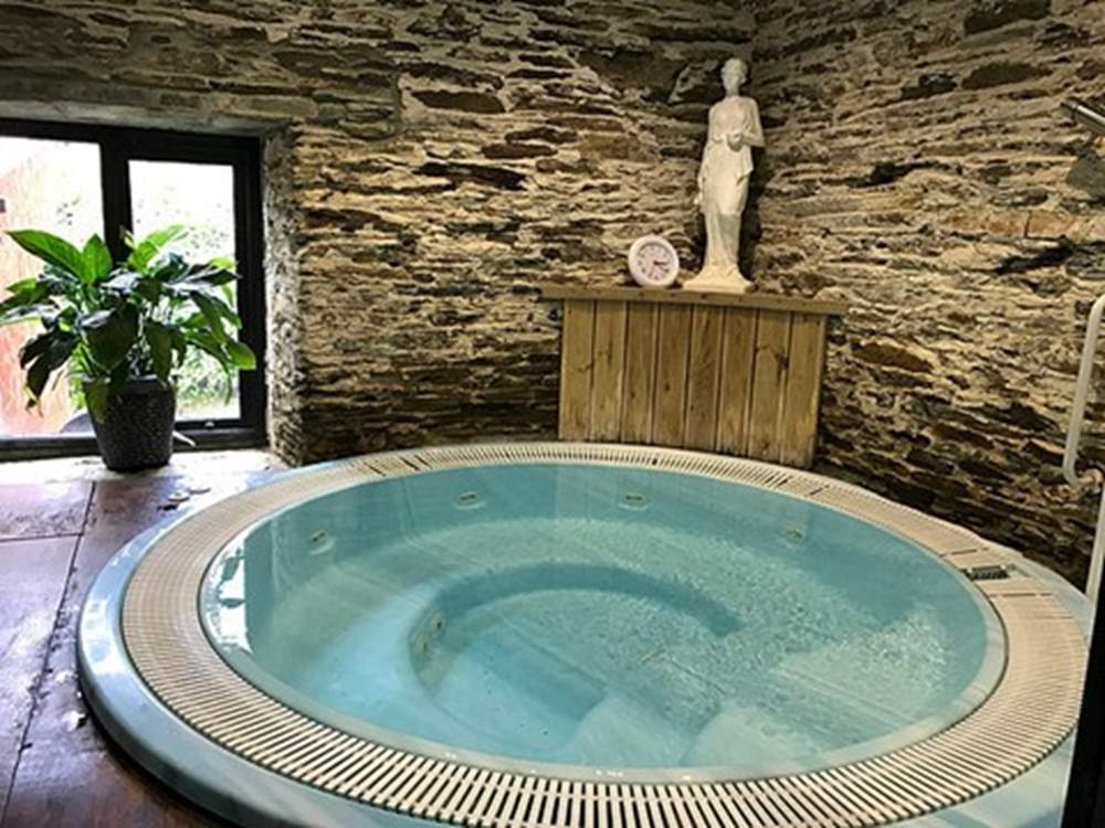 Settle down in the luxurious hot tub.