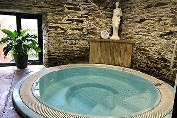 Settle down in the luxurious hot tub.