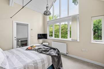 The magnificent, large window floods the room with natural light.