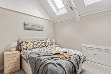 Bedroom two's high ceilings give it a wonderful light and airy feel.