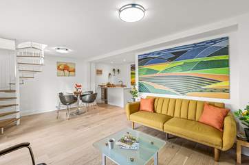 Down the spiral staircase, you will find a fabulous second living space.