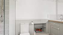 Unwind in bedroom one's gorgeous en suite.
