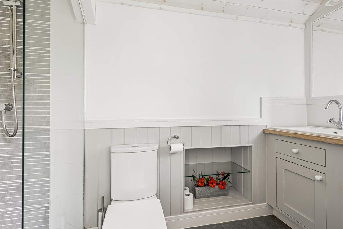 Unwind in bedroom one's gorgeous en suite.