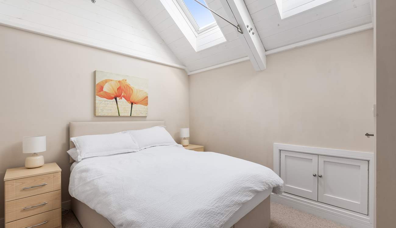 Bedroom 2's high ceilings give it a wonderful light and airy feel.