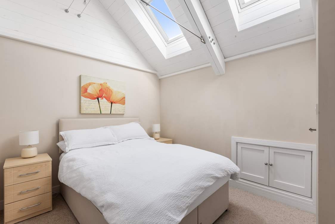 Bedroom 2's high ceilings give it a wonderful light and airy feel.