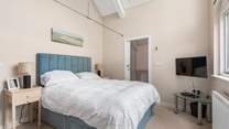 Bedroom 1 comes equipped with a lavish king-size bed, TV and an excellent en suite.