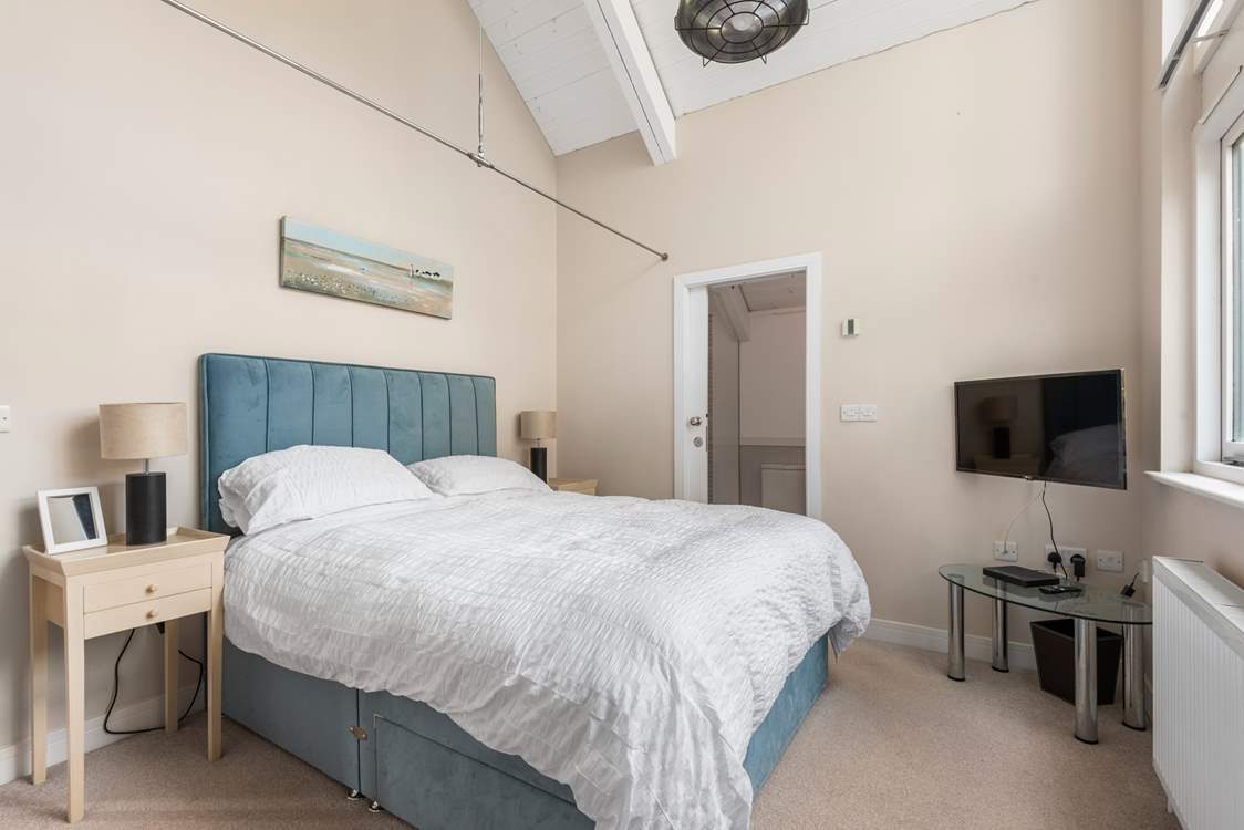 Bedroom 1 comes equipped with a lavish king-size bed, TV and an excellent en suite.