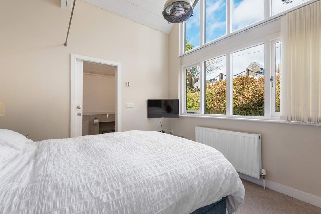 The magnificent, large window floods the room with natural light.