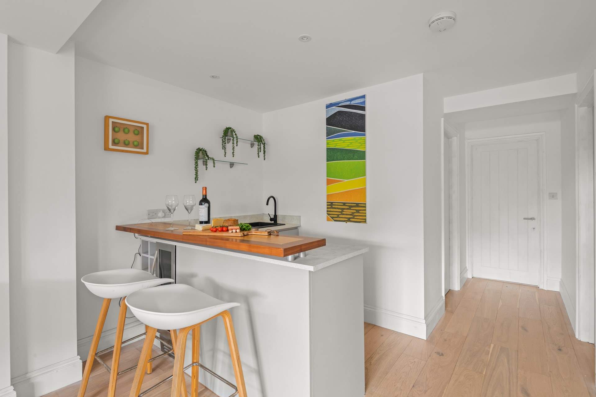 No need to head upstairs for another bottle of wine. Downstairs you will find the Summer Kitchen equipped with a fridge, sink and that all important wine fridge!