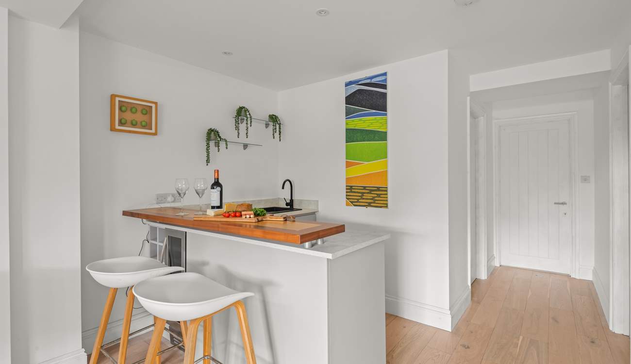 No need to head upstairs for another bottle of wine. Downstairs you will find the Summer Kitchen equipped with a fridge, sink and that all important wine fridge!