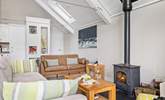 The toasty wood-burner keeps the house nice and cosy. - Thumbnail Image