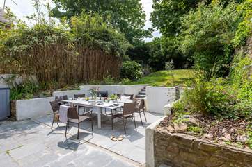 The garden is seven steps up from the patio.