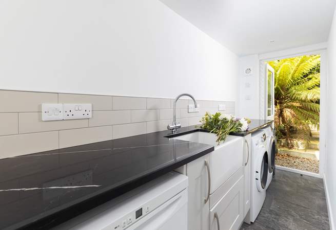 A handy separate utility-room with freezer, washing machine and tumble-drier.