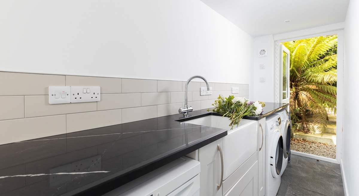 A handy separate utility-room with freezer, washing machine and tumble-drier.