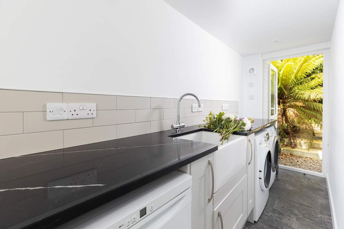 A handy separate utility-room with freezer, washing machine and tumble-drier.