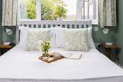 Bedroom 1 is beautifully furnished with luxury linens.